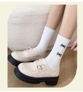 Sweet college style women socks with plaid bows and pearls paired with platform leather shoes.