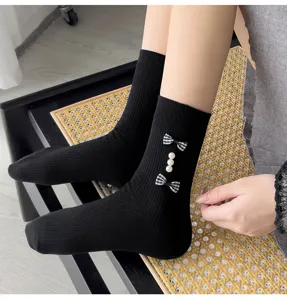 Sweet plaid bow and pearl black ribbed socks for women, cute academy style daily wear.