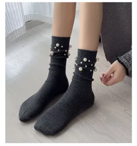 Women dark grey ribbed knit slouch socks featuring elegant pearl beaded cuffs for winter.