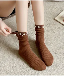 Brown ribbed crew socks featuring elegant faux pearl beaded cuffs for stylish daily wear.