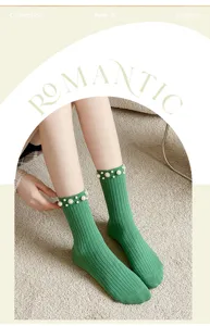 Exquisite green ribbed mid-calf socks featuring elegant pearl and rhinestone embellishments.