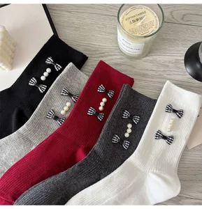 Sweet style women crew socks featuring cute plaid bows and elegant pearl details, autumn winter.