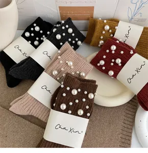 Detailed view of stylish women pearl knit socks with elegant beaded design and warm fabric.