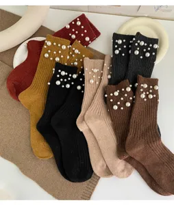 Korean style women winter warm ribbed knit mid-tube socks embellished with scattered faux pearls.