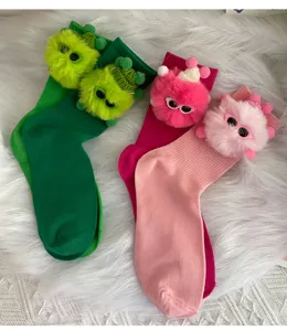 Close-up detail of cute fuzzy plush doll plushie decorated mid-tube socks in vibrant colors.