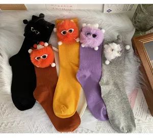 Cute plush monster doll mid tube socks for women, Korean style playful cotton casual hosiery.