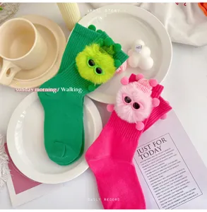Cute kids crew socks with fluffy monster plush design, soft knit fashion footwear for girls.