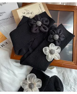 Black mid-calf socks featuring 3D chiffon floral appliques and sparkling centers.