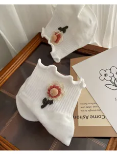 Sweet white ruffled mid-tube socks featuring 3d cute floral decoration for women girls.