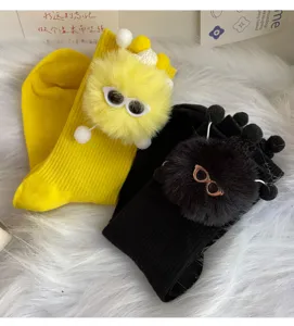 Cute plush doll mid-calf socks for women, trendy fuzzy monster design, warm college style socks.