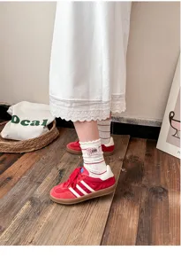 Cute ruffled cotton mid-tube socks with red retro sneakers detail shot, breathable and stylish.