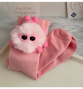 Cute pink knit mid-tube socks featuring a fluffy plush doll with trendy sunglasses detail.