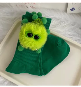 Green mid-calf socks for women featuring cute plush doll and sunglasses decoration, kawaii style.