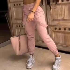 Pink high street multi-pocket cargo pants for women, trendy slim fit tapered casual trousers.