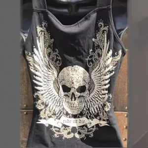 Black gothic tank top featuring a striking silver skull and wings graphic with ride or die.