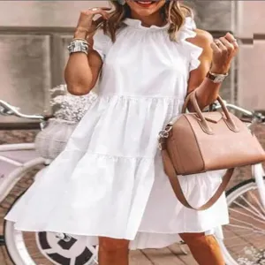 Detail shot of the stylish white sleeveless tiered summer dress, showing exquisite ruffle collar.