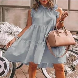 Detail view of the summer casual sleeveless tiered dress with ruffle collar and flared hem.