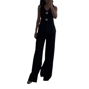 Elegant black vest and wide leg pants set, V-neck sleeveless top with gold buttons.