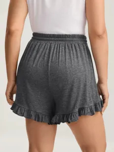 Lässige graue Shorts mit hohem Bund und Rüschensaum, bequeme Passform für den Sommer.