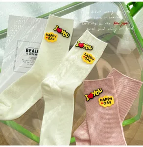 Cute women's mid-calf ribbed socks with colorful silicone cartoon patches, sweet aesthetic.
