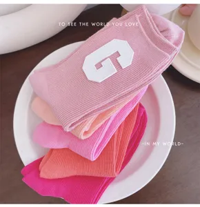 Colorful macaron mid-tube socks for women with cute letter patch sweet candy daily wear.