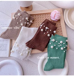 Detailed view of Japanese style pearl embellished ribbed knit mid-tube socks for women fashionable.