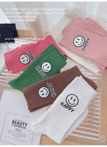 Cozy knit ribbed socks with cute smiley face patch and happy letter detail for autumn winter wear.
