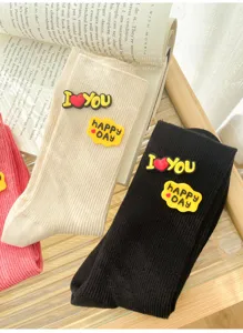 Cute women mid-calf socks with funny silicone letter patches, stylish casual knit striped hosiery.