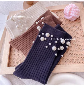Women knitted pearl mid-tube socks detailed view, cozy knit texture with elegant pearls.