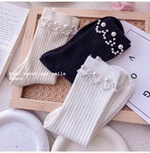 Pearl embellished ribbed mid-calf socks detail, elegant design for women daily wear.