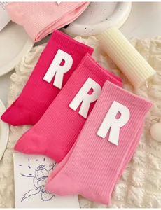 Pink mid-tube socks with white letter R patches, cute Japanese sweet style cotton knit hosiery.
