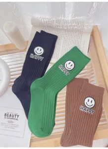 Korean style ribbed crew socks for women, featuring cute smiley face patches and thick stripes.