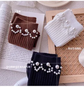 Chic pearl embellished mid-calf knitted socks for women, trendy autumn daily wear style.