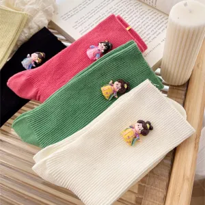 Women cute vertical striped mid tube socks with traditional Chinese doll charms, main flat lay.