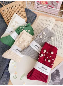 Detail view of women's pearl studded ribbed mid-calf cotton socks in multiple colors.
