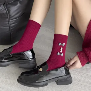 Sweet bow pearl socks matching stylish black loafers, perfect for autumn and winter daily wear.