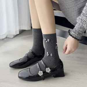 Sweet Korean style grey mid-calf socks with bows and pearls, paired with black Mary Jane shoes.