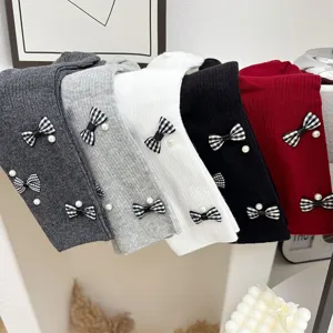 Korean sweet bow pearl knitted mid-calf socks for women, versatile and cute daily wear.