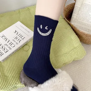 Ribbed mid-calf socks for women with sparkling rhinestone smiley face design cozy winter socks