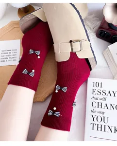 Women red ribbed mid-tube socks featuring chic black white plaid bows and pearls daily wear.
