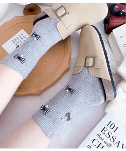 Korean style grey ribbed socks with chic plaid bows pearls and cozy beige clogs shoes.
