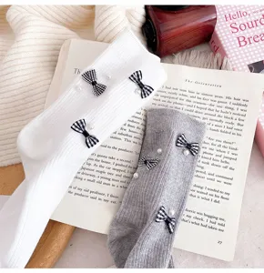 Women cute mid-tube socks featuring chic plaid bows and elegant pearl decorations for daily wear.