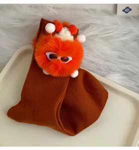 Cute plush doll mid-calf socks with brown fuzzy monster design and novelty style for women