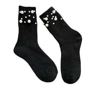 Women black ribbed mid-calf socks decorated with elegant white pearls for winter warm daily wear.