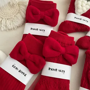 Red cute bow cotton mid-calf socks for women, sweet Japanese style festive new year gift.