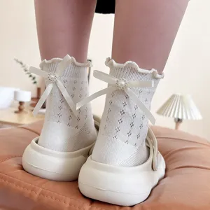 Women summer thin breathable mesh mid-tube socks featuring ruffles, bows and elegant pearl accents.