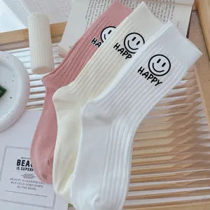 Women thick ribbed mid-calf socks with cute smiley face and happy letter print for daily wear.