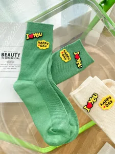 Trendy Korean style cute letter silicone decorated colorful striped mid-tube socks main view