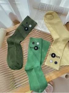 Cute slouch socks for women, fun smiley and number print, warm knit mid-calf hosiery.