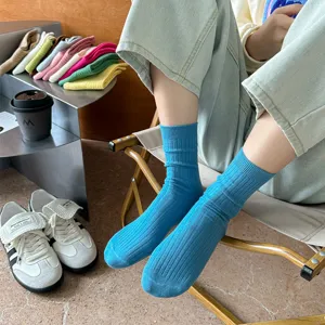 Comfortable solid color ribbed mid-tube socks for women, perfect for daily casual wear.